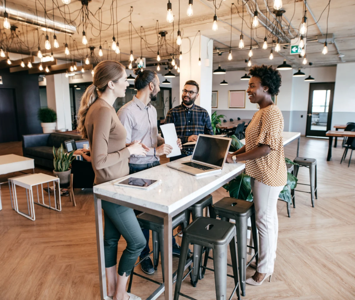 Colleagues collaborating in stylish workspace