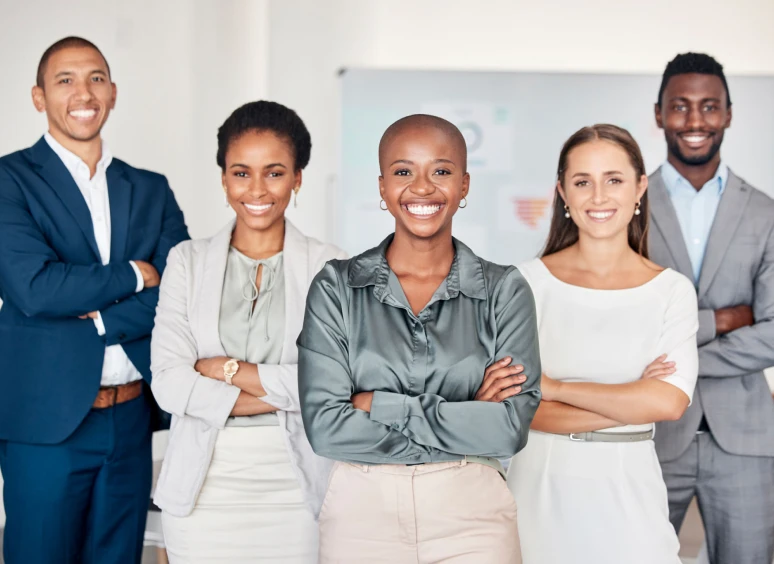 Colleagues posing with arms crossed